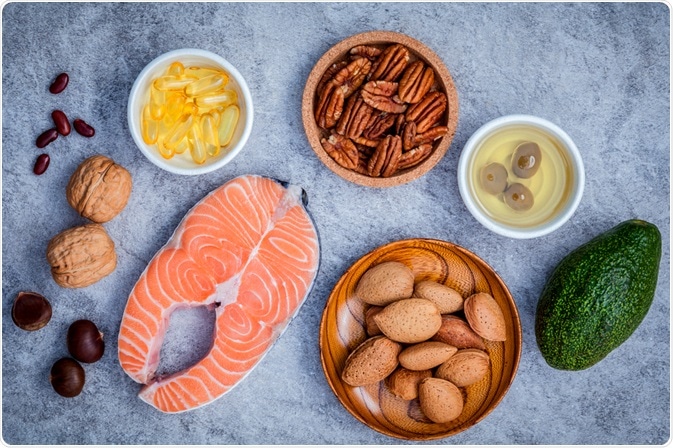 High fat healthy foods - fish, vitamins, nuts and avocado - photo taken by Kerdkanno High fat healthy foods - fish, vitamins, nuts and avocado - photo taken by Kerdkanno