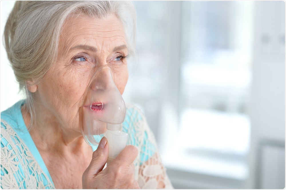 Woman with oxygen mask on