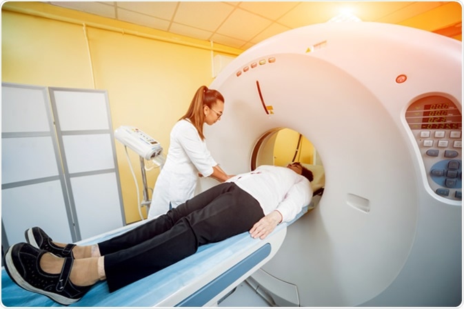 Doctor and patient in the room of computed tomography at hospital. Image Credit: Romaset / Shutterstock