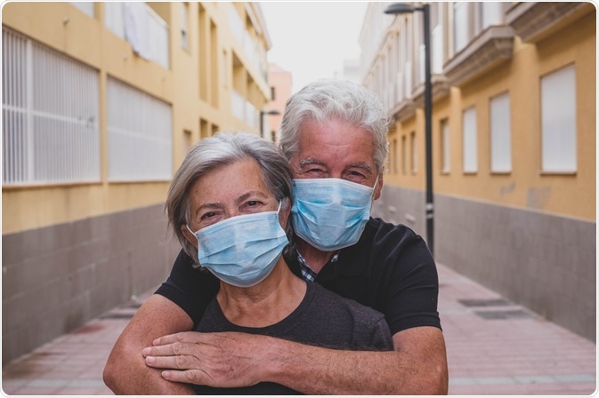 Elderly couple wearing face masks Elderly couple wearing face masks