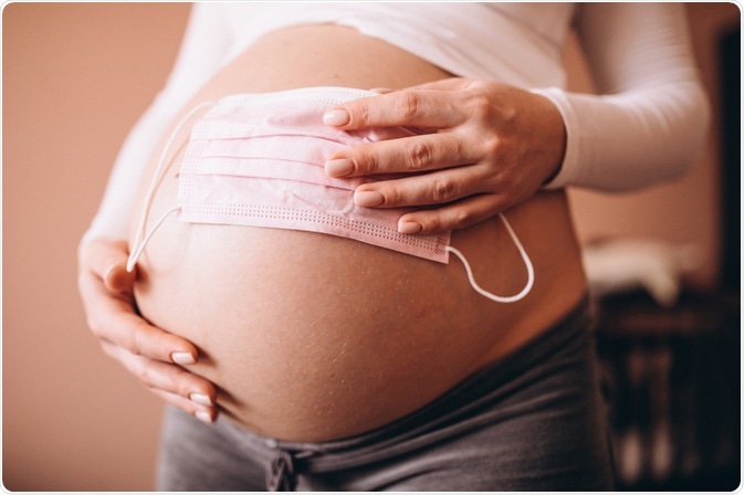 Pregnant Women holding Face Mask Pregnant Women holding Face Mask