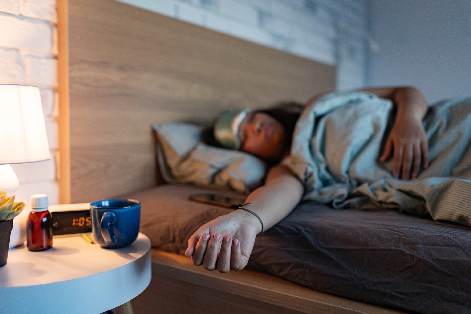 Woman sleeping with sleep mask.