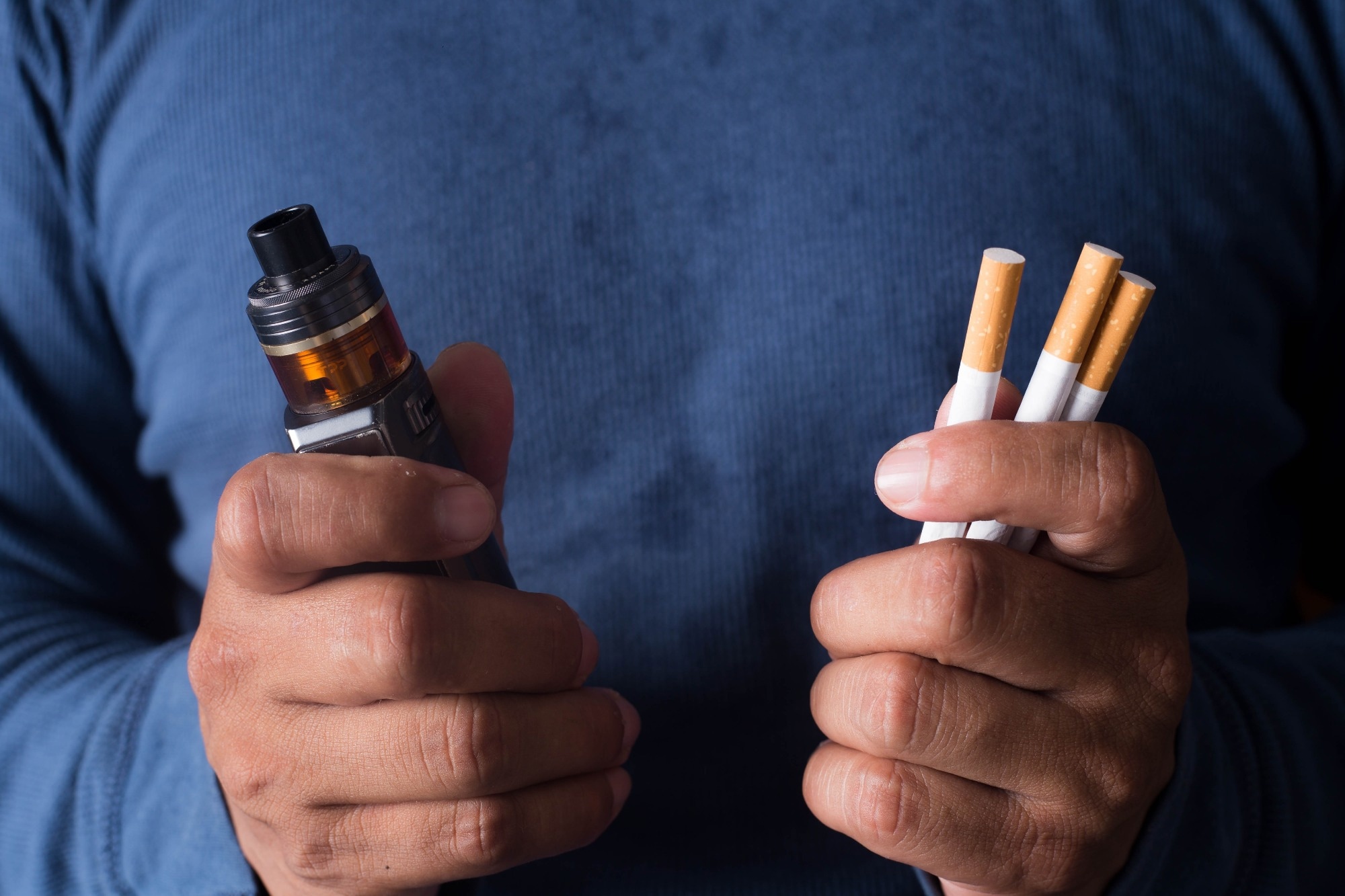 Concept of choosing the type of cigarette, a man